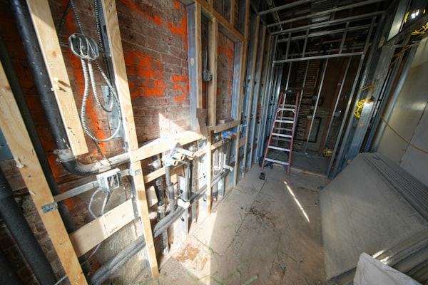 Interior construction with exposed pipes and framing